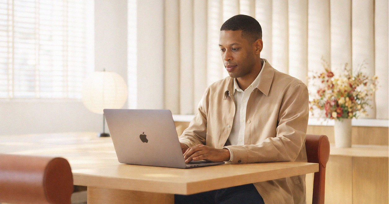 Man at office desk with laptop